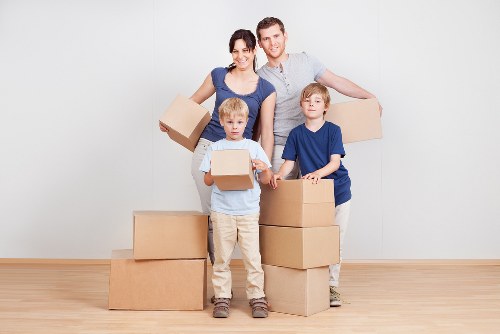 Packed office boxes and equipment ready for local relocation