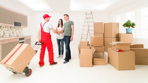 Supervisor reviewing safety procedures near a moving van
