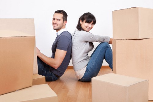 Packed boxes and room labels arranged for a smooth move in Belsize Park